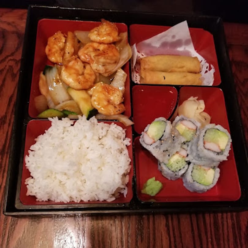 Toko Japanese Steakhouse bento box with shrimp, rice, California rolls, and spring rolls.